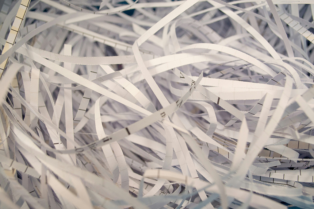 Paper records processed through a confidential shredding service